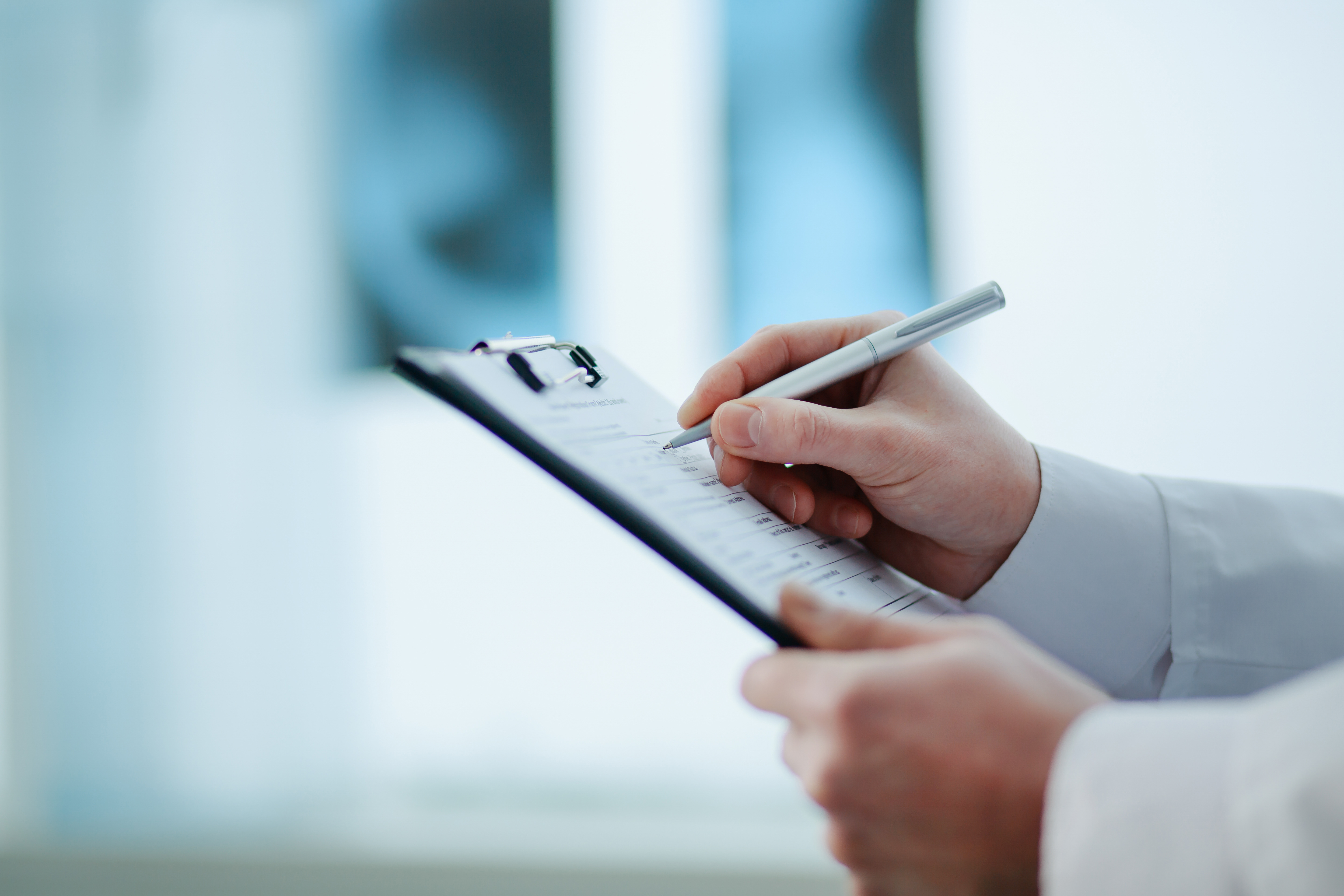 Doctor completing medical paperwork and documentation